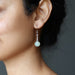 serpentine earrings on model