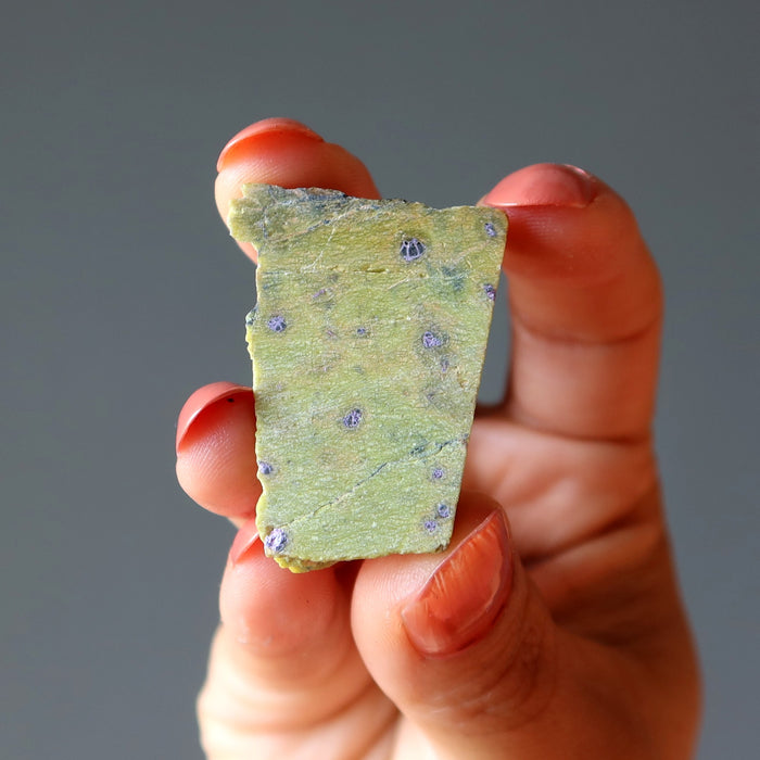 hand holding Green raw Serpentine Crystal