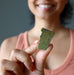 hand holding Green raw Serpentine Crystal