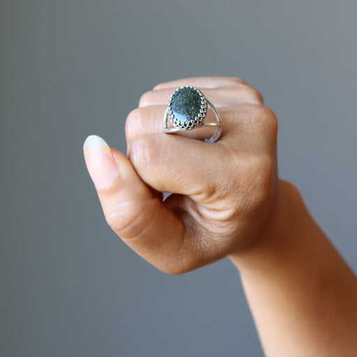 hand holding russian serpentine sterling silver adjustable ring