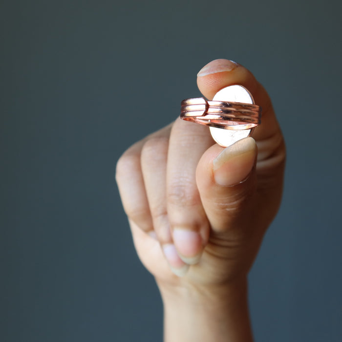 hand holding adjustable copper ring