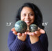 sheila holding 2 Serpentine Spheres one on each hand