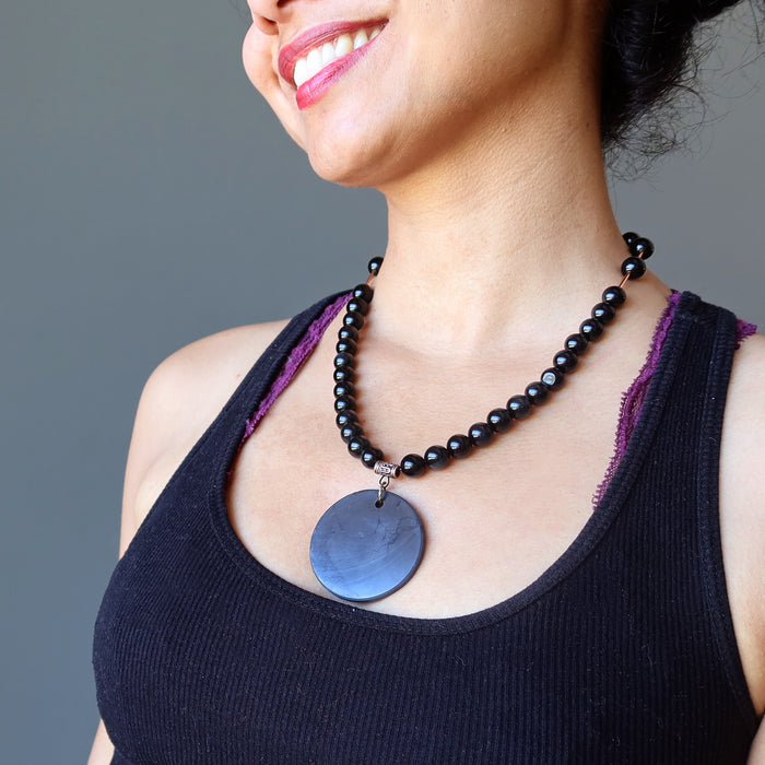 sheila of satin crystals wearing a shungite and rainbow obsidian beaded necklace