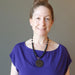 woman wearing shungite rainbow obsidian necklace