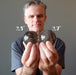 ryan of satin crystals holding two smoky quartz spheres