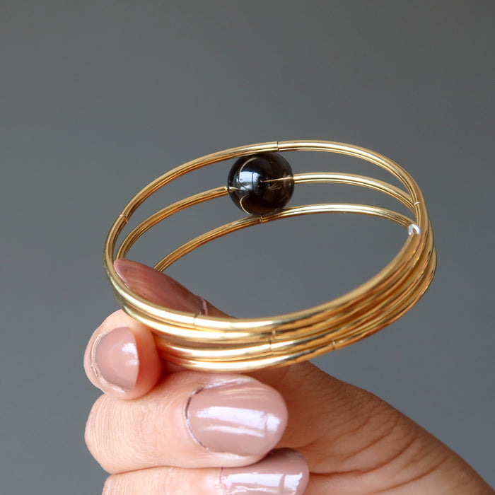 hand holding Smoky Quartz Bracelet