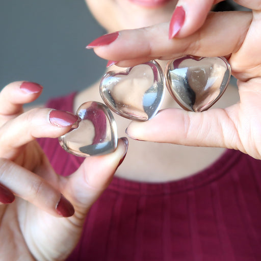 Sheila holding 3 Smoky Quartz hearts