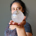 woman holding included smoky quartz sphere