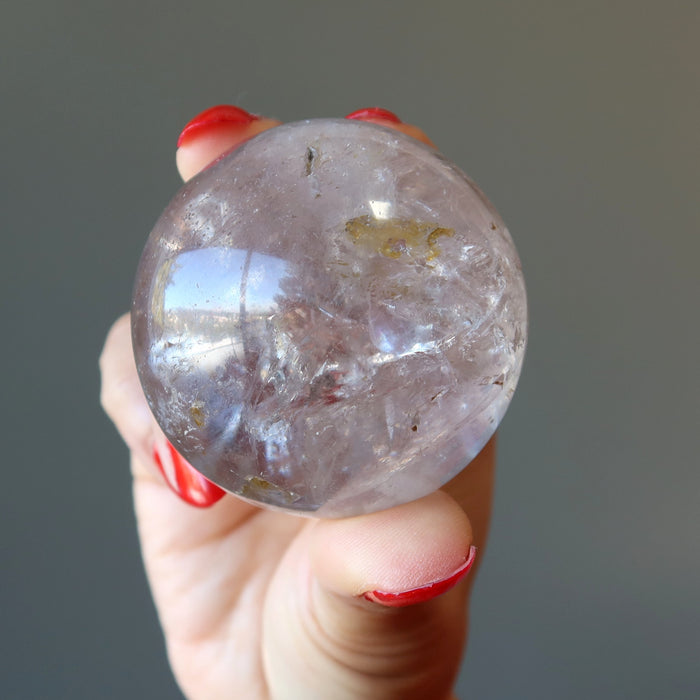 holding Smoky Quartz Sphere