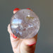 holding Smoky Quartz Sphere