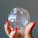 holding Smoky Quartz Sphere