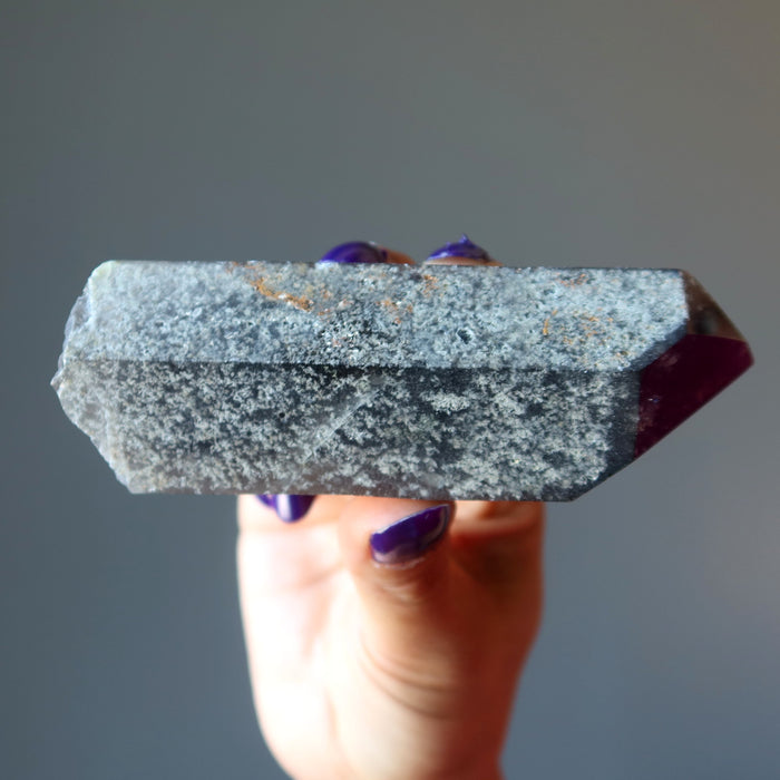 holding Smoky Quartz Point Wand