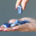 Sodalite Tumbled Stone on the model palm