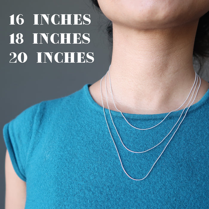 sheila of satin crystals wearing 3 sizes of sterling silver snake chain necklace