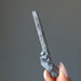 holding raw Stibnite wand 