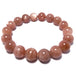 sunstone stretch bracelet with round beads of pink tone and silver sheen