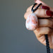 hand holding Sunstone Necklace