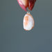 hand holding Sunstone Pendant Drop pendant