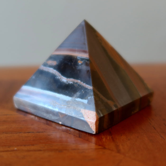 tiger iron pyramid on table