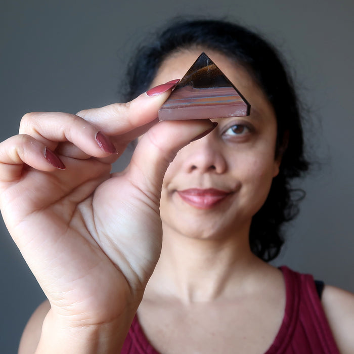 woman with tiger iron pyramid at third eye