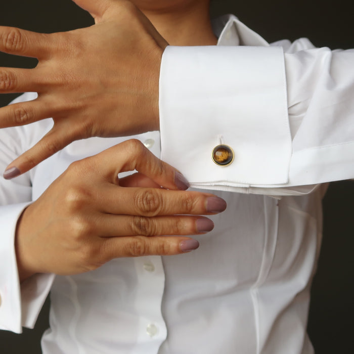 woman modeling tigers eye gold cufflinks