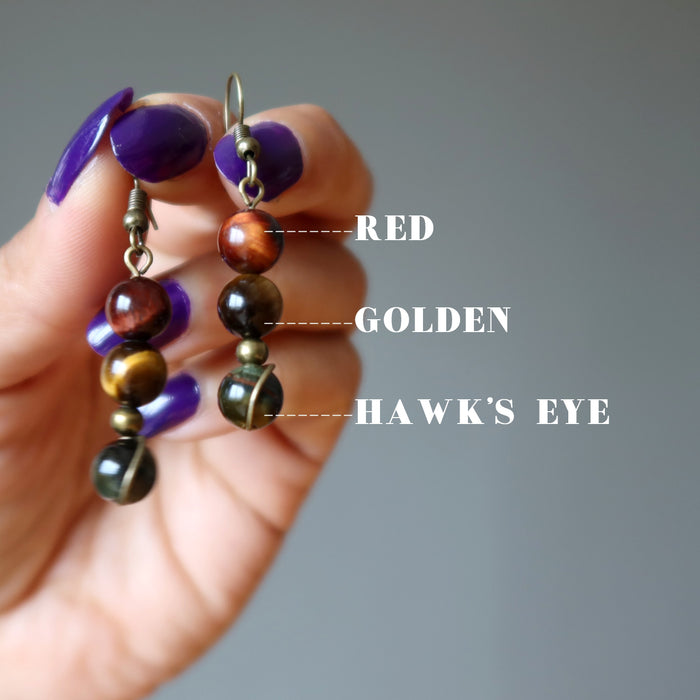 hand holding Tigers Eye Earrings