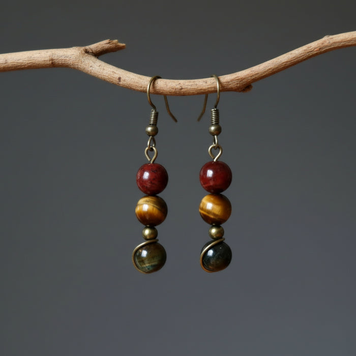 holding Tigers Eye Earrings 