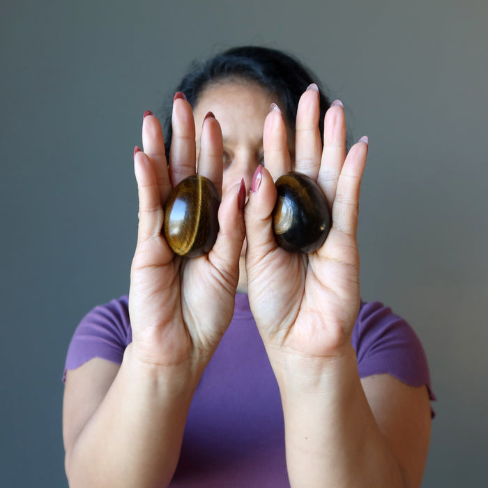 sheila raising two eggs on her palms forward