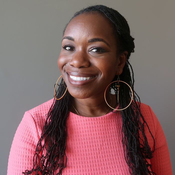 bridget of satin crystals wearing tigers eye arrow orange hoop earrings