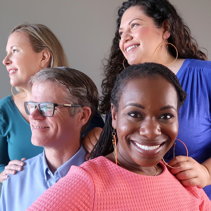 bridget of satin crystals wearing tigers eye arrow orange hoop earrings