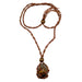 An adjustable brown macrame necklace with a tumbled Tigers Eye stone pendant.