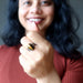 woman wearing tigers eye gunmetal ring 