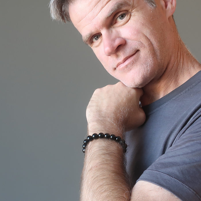 ryan of satin crystals wearing a black tourmaline bracelet