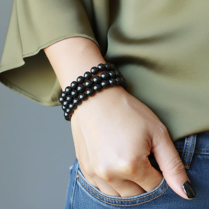 three black tourmaline bracelets on wrist