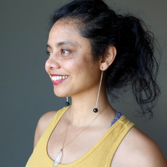 woman wearing black tourmaline sterling silver earrings