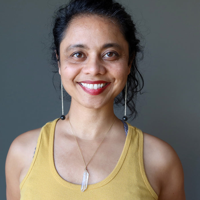 woman wearing black tourmaline sterling silver earrings