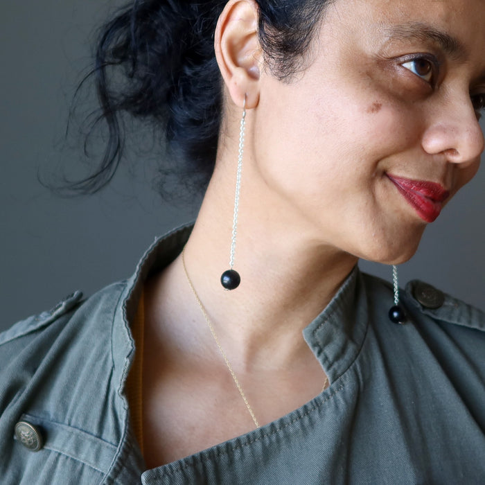 woman wearing black tourmaline sterling silver earrings