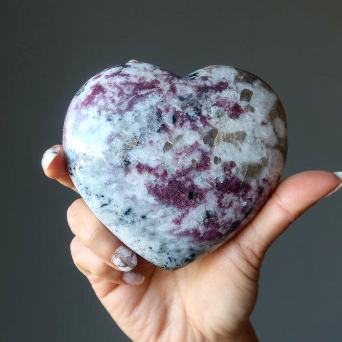 rubellite tourmaline heart in hand