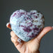 rubellite tourmaline heart in hand