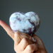 rubellite tourmaline heart in hand