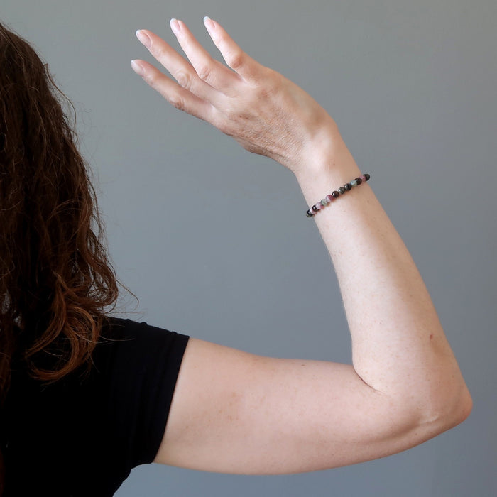 jamie of satin crystals wearing a tourmaline bracelet