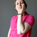 A Satin Crystals model shows off her Pink Rubellite Tourmaline bracelet made from real gemstones and round beads