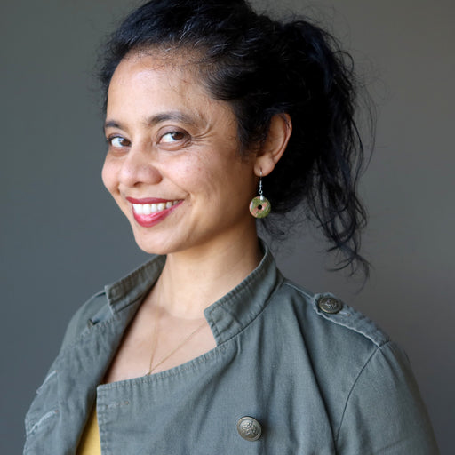 woman modeling unakite donut earrings