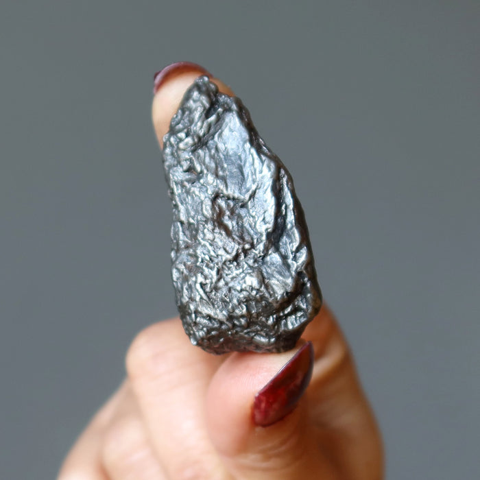 hand holding uruaca meteorite