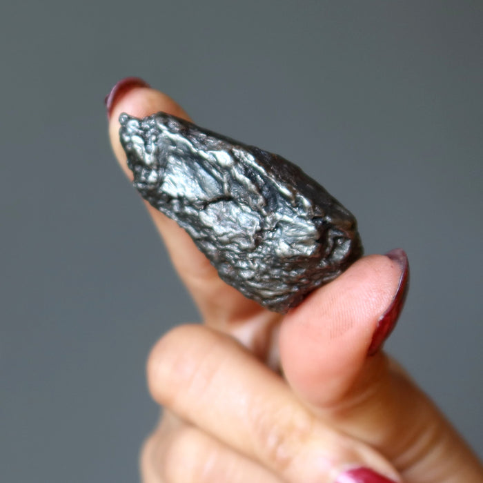 hand holding uruaca meteorite