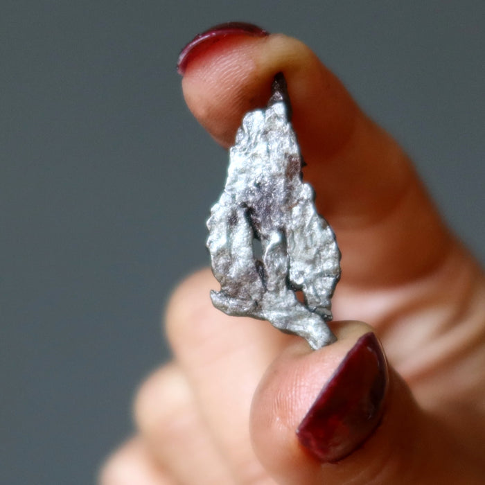 hand holding uruaca meteorite