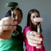 jessica and holly of satin crystals holding jade and rose quartz facial roller wands