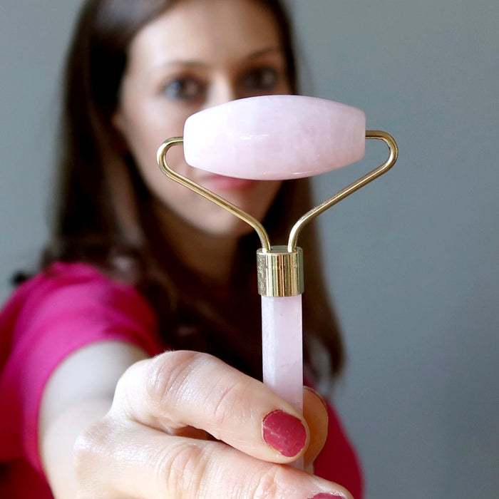 A Rose Quartz facial roller wand 